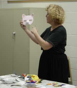 Susan demonstrates a 'pig' puppet